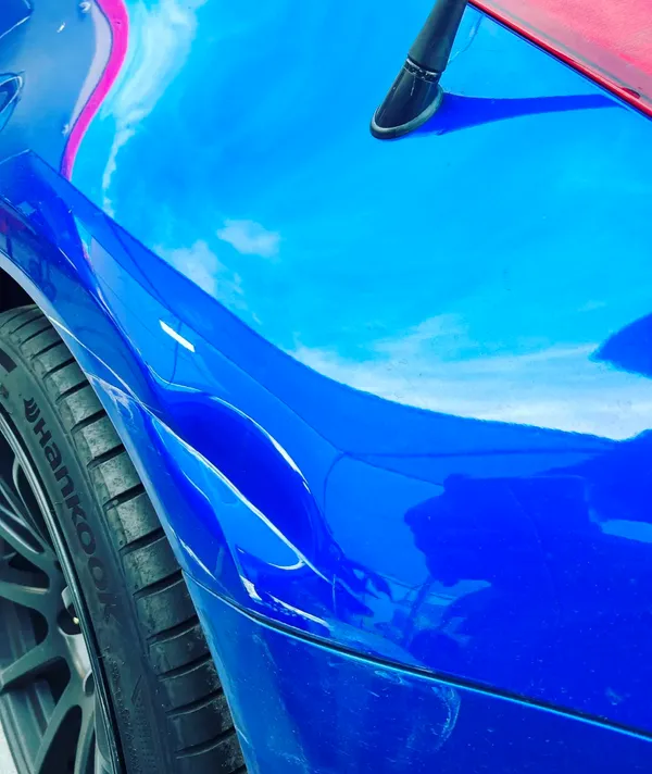 Precision automotive paint work and body repair being completed by certified technician